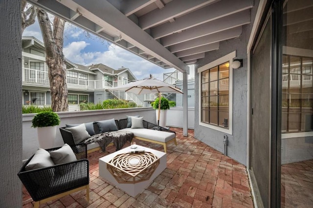 balcony with outdoor lounge area and a patio area