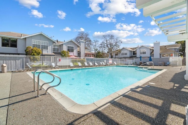 view of swimming pool featuring a pergola and a patio