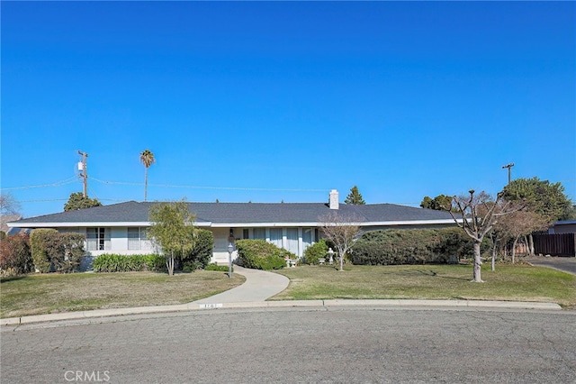 ranch-style house with a front yard