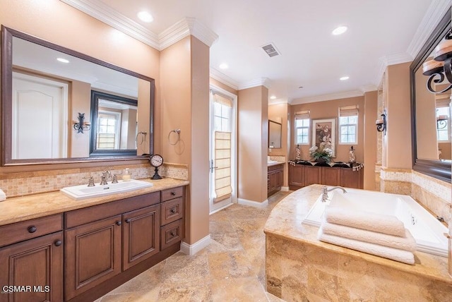 bathroom with ornamental molding, a wealth of natural light, and decorative backsplash