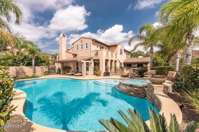 view of pool featuring an in ground hot tub, a gazebo, and a patio