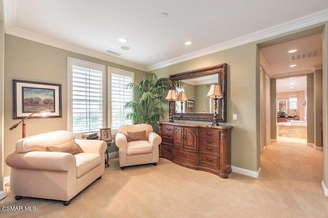 sitting room with crown molding and light colored carpet