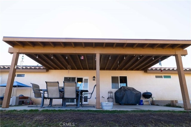 rear view of house featuring a patio