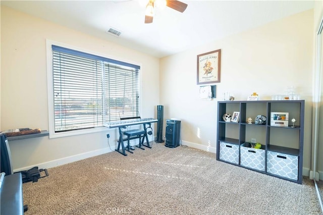 miscellaneous room featuring carpet floors and ceiling fan