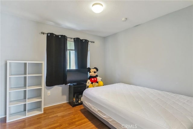 bedroom featuring hardwood / wood-style floors