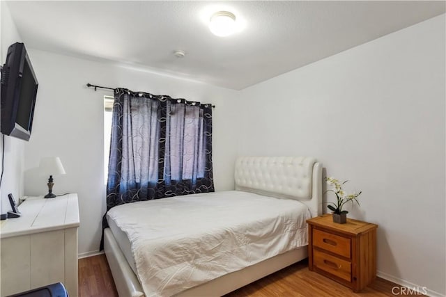 bedroom featuring wood-type flooring