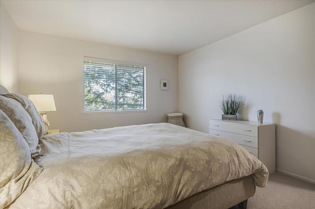 bedroom featuring light carpet