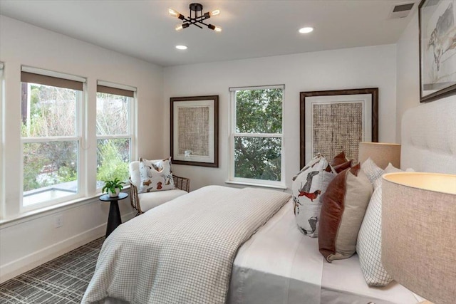 bedroom with a chandelier