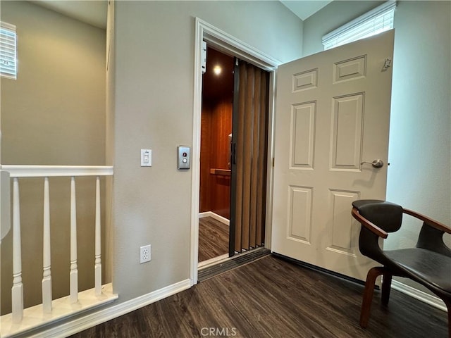 corridor featuring dark hardwood / wood-style floors