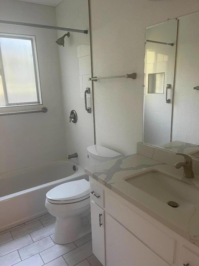 full bathroom with tiled shower / bath combo, vanity, and toilet