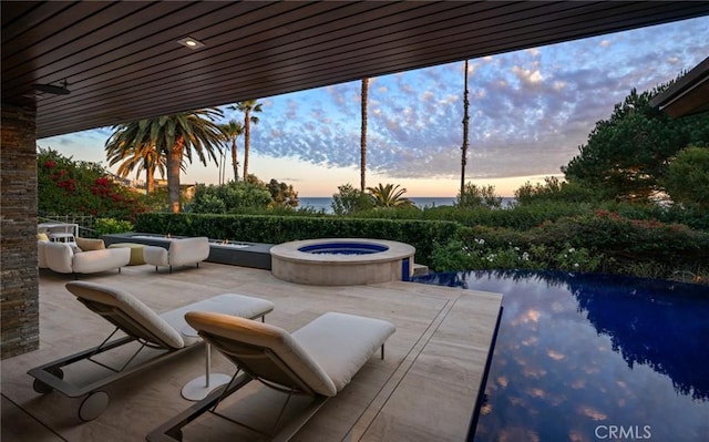 patio terrace at dusk with a water view