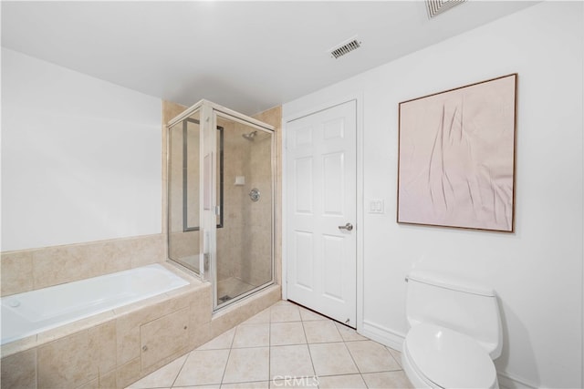 bathroom with tile patterned flooring, independent shower and bath, and toilet