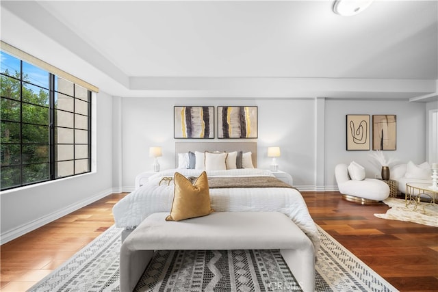 bedroom with wood-type flooring