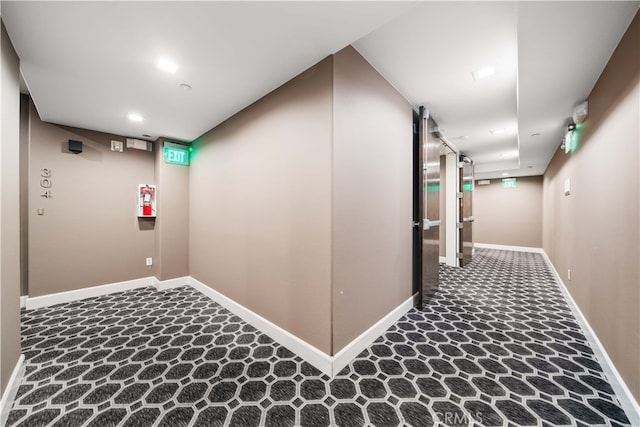 corridor with carpet floors