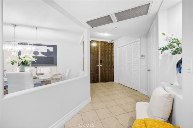 hallway with light tile patterned flooring