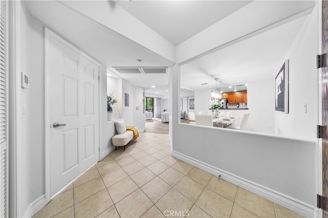 interior space with light tile patterned floors