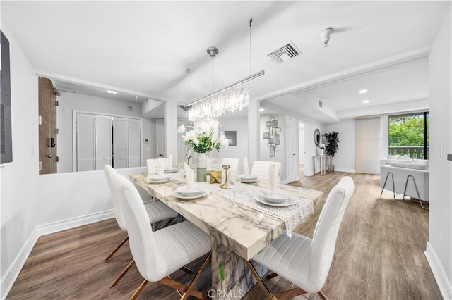 dining area with wood-type flooring