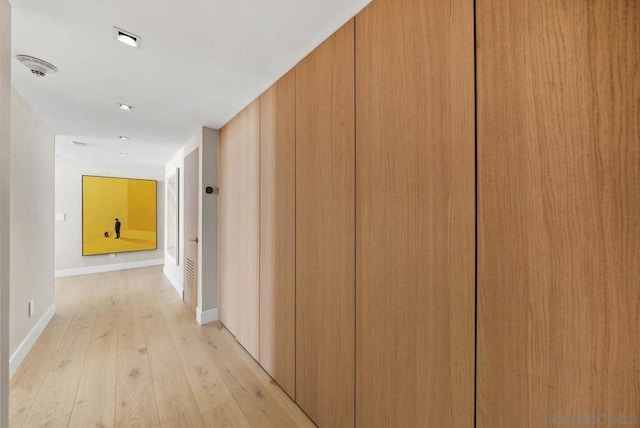 corridor featuring light hardwood / wood-style floors