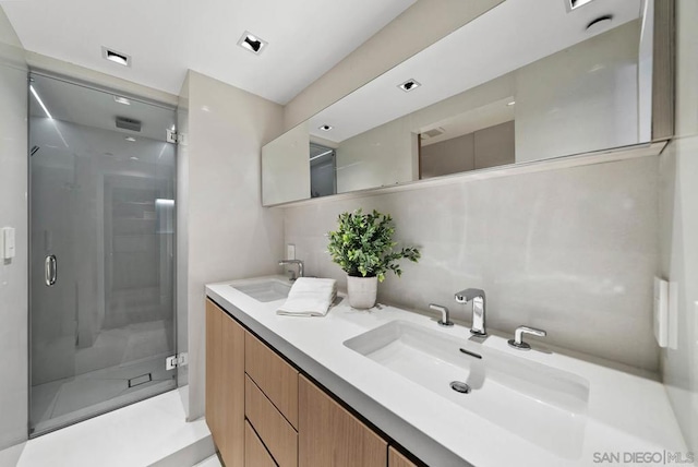 bathroom with vanity and an enclosed shower