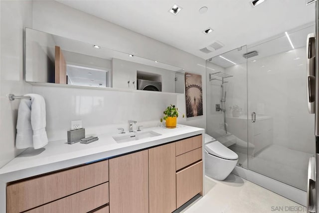 bathroom featuring vanity, a shower with door, and toilet