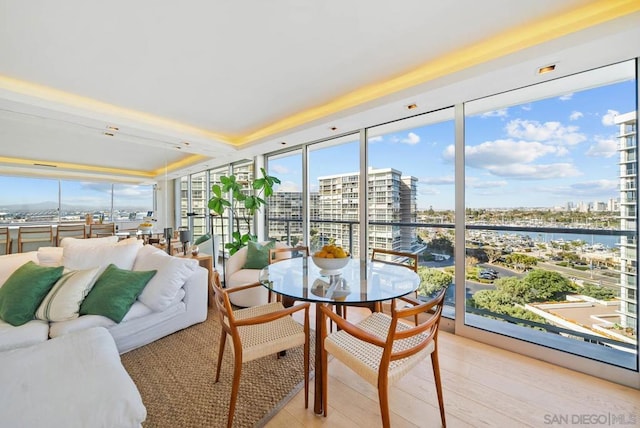 sunroom / solarium featuring a water view