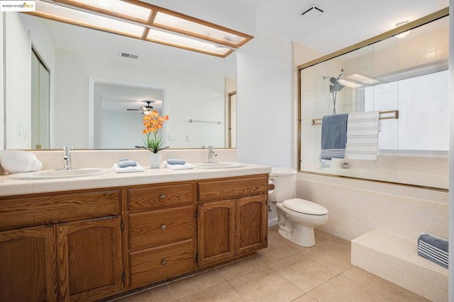 full bathroom featuring tile patterned flooring, vanity, enclosed tub / shower combo, ceiling fan, and toilet