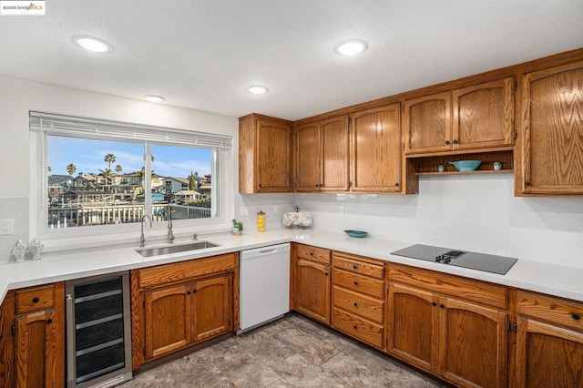 kitchen featuring wine cooler, sink, a water view, black electric cooktop, and white dishwasher