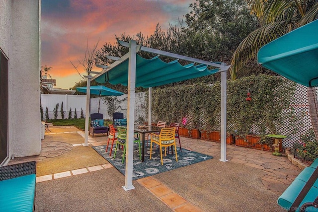 view of patio terrace at dusk