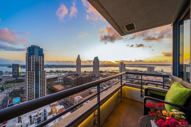 balcony at dusk with a water view