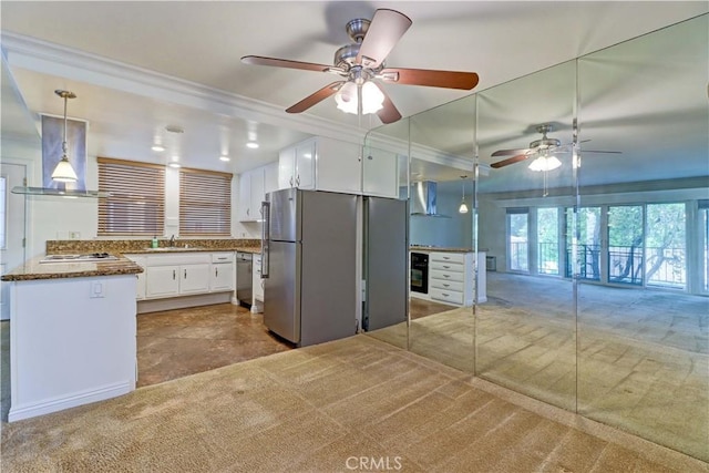 kitchen with sink, white cabinetry, island range hood, decorative light fixtures, and stainless steel appliances