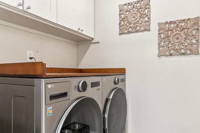 laundry area featuring cabinets and washer and dryer