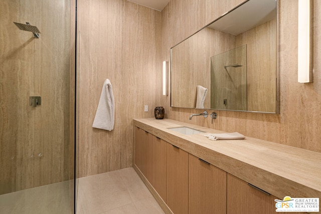 bathroom with vanity, tile patterned floors, and walk in shower