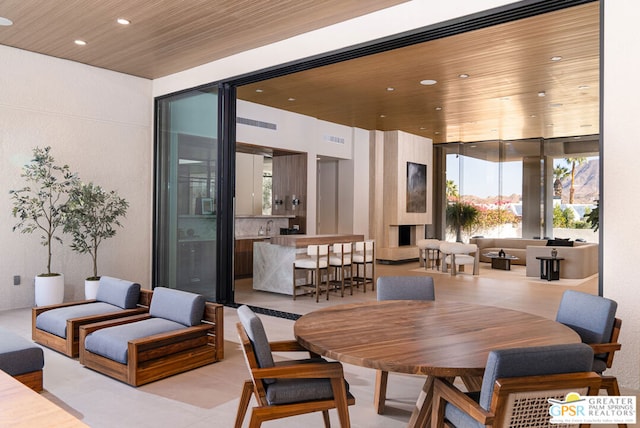 dining area featuring wood ceiling