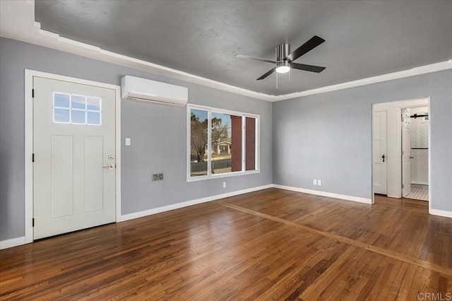 entrance foyer with ceiling fan, dark hardwood / wood-style floors, and a wall unit AC