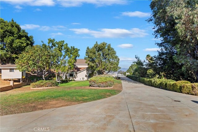 view of home's community with a lawn