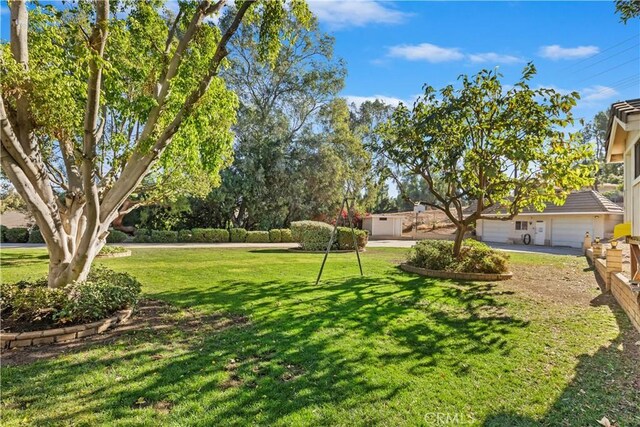 view of yard featuring a garage