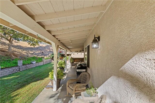 view of patio featuring a grill