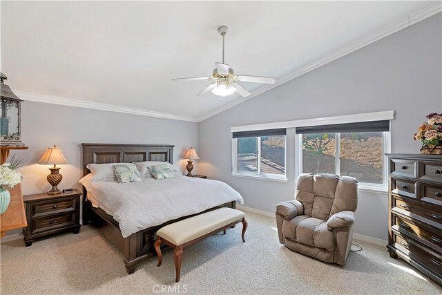 carpeted bedroom featuring crown molding, ceiling fan, and lofted ceiling