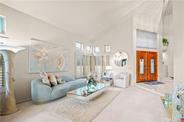 living room featuring high vaulted ceiling and carpet