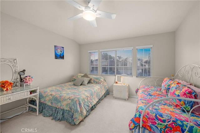 carpeted bedroom featuring vaulted ceiling and ceiling fan