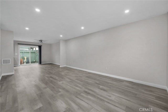 spare room featuring ceiling fan and light wood-type flooring