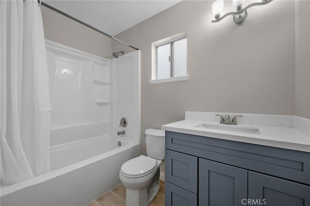 full bathroom featuring hardwood / wood-style flooring, vanity, shower / bath combination with curtain, and toilet