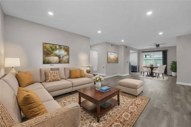 living room with wood finished floors, baseboards, recessed lighting, and a ceiling fan
