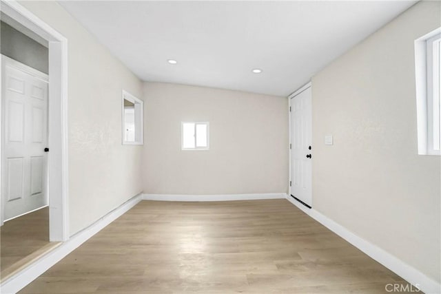 unfurnished room with light hardwood / wood-style flooring