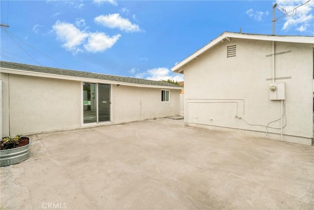 rear view of house with a patio area