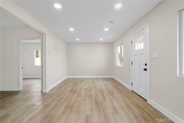 entrance foyer featuring light hardwood / wood-style floors and a wealth of natural light