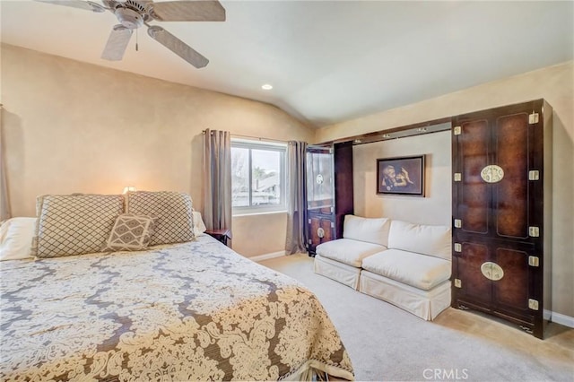 carpeted bedroom with lofted ceiling and ceiling fan