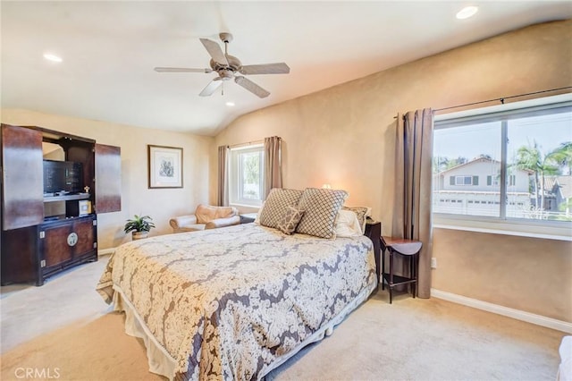 bedroom with ceiling fan, light colored carpet, and lofted ceiling