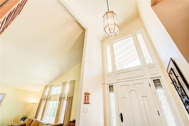 foyer with high vaulted ceiling