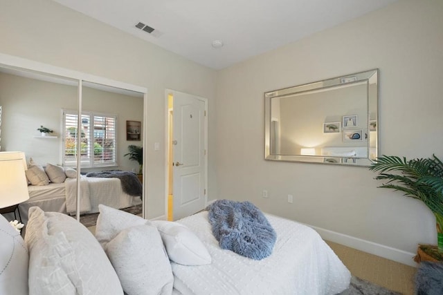 carpeted bedroom featuring a closet